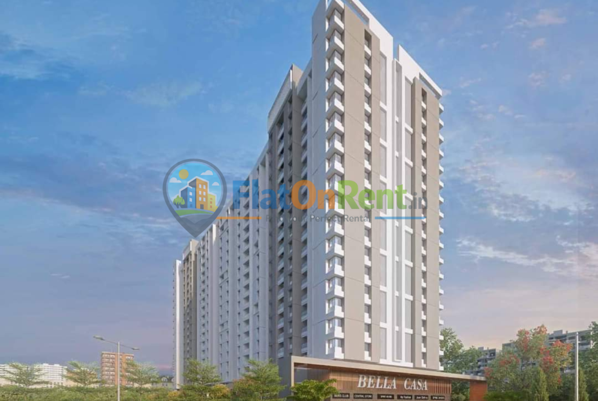 Modern high-rise residential tower with beige and white facade, Bella Casa storefront at street level against a blue sky.